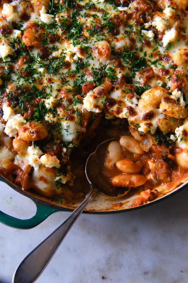 pizza beans in a large skillet topped with melted cheese