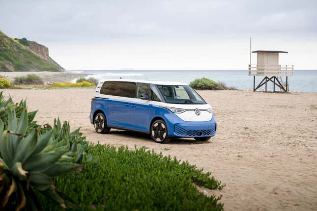 a blue and white Buzz parked on a beach