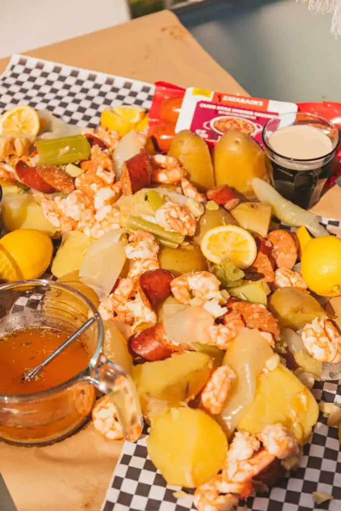 Shrimp Boil outdoors on butcher paper. 