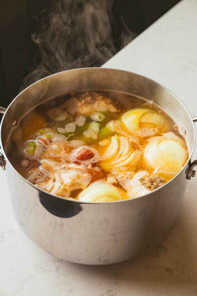 Stockpot of shrimp boil on table. 