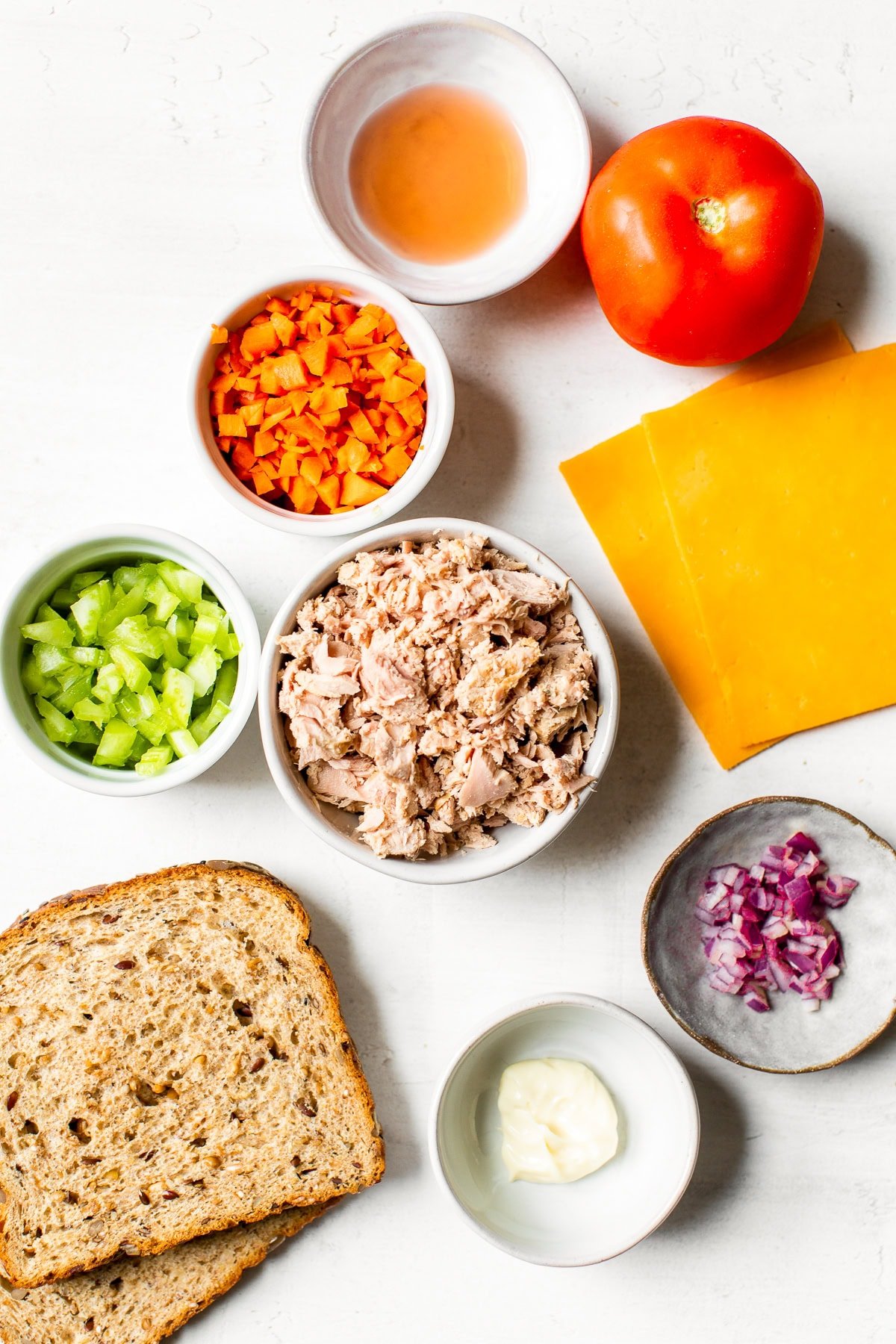 Canned tuna, tomato, cheese and bread